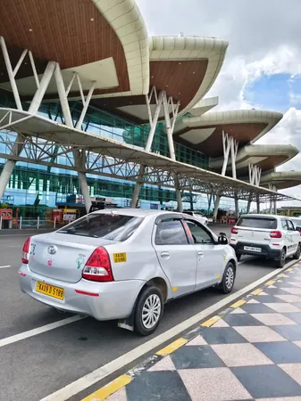 Toyota Etios sedan side view for budget airport drop
